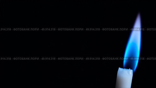 Striking minimalist photograph of a single blue flame against a black background emphasizing vibrancy and elegance. Стоковое AI-изображение, AI-художник Андрей Бакусов / Фотобанк Лори