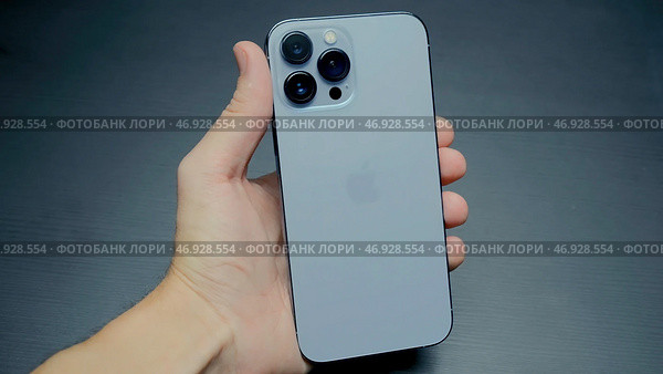 Stylish exterior design of new iPhone with metal case and three cameras (2021 год). Редакционное фото, фотограф David Kashakhi / Фотобанк Лори
