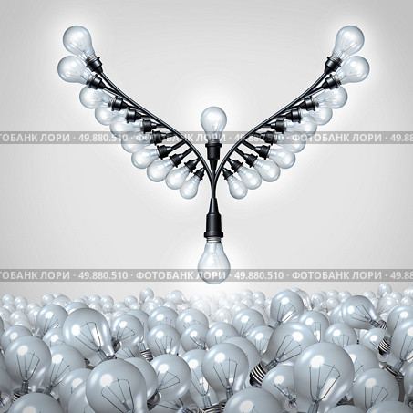 Successful ideas as a business metaphor for creative innovation taking off as a group of organized light bulbs shaped as open bird wings rising up out of a mountain using the bulb icon as a symbol of the power of imagination and intelligence. Стоковое фото, агентство Ingram Publishing / Фотобанк Лори