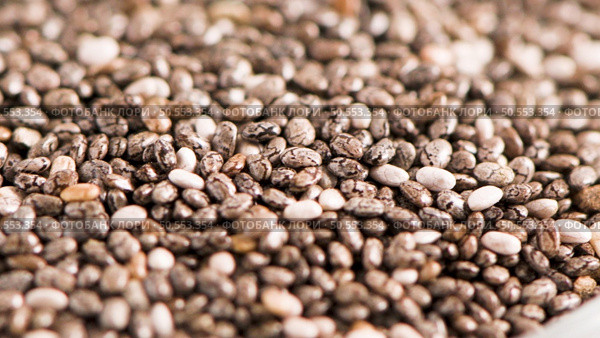 Superfoods on a gray background with copy space. Nuts, beans, greens and seeds. Healthy vegan food. Стоковое фото, агентство Ingram Publishing / Фотобанк Лори