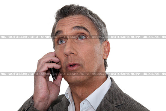 Surprised man looking at a screen. Стоковое фото, агентство Ingram Publishing / Фотобанк Лори