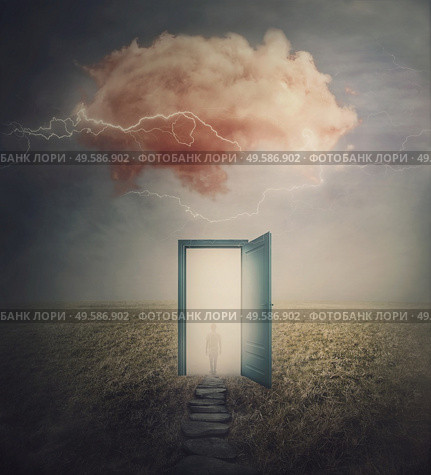Surreal scene, teleportation concept, time and space traveling through a open door on a mystic land. Magic cloud in the sky, mysterious lightnings and a wanderer person silhouette in the mist. Стоковое фото, агентство Ingram Publishing / Фотобанк Лори