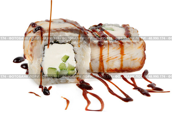 Sushi closeup isolated on white background. Sushi roll with graham rice, Philadelphia cheese and celery topped with soy sauce. Стоковое фото, фотограф Лазаренко Светлана / Фотобанк Лори