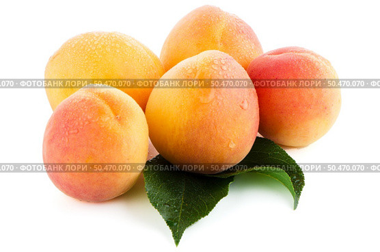 Sweet peaches with leafs on a white background. Стоковое фото, агентство Ingram Publishing / Фотобанк Лори