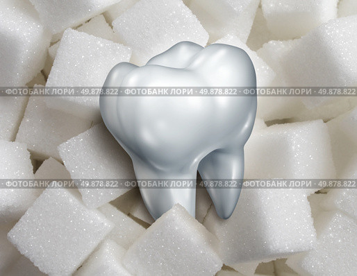 Sweet tooth dental health care concept with a single molar in a pile of sugar cubes as a health and diet symbol for craving sweetened foods that are bad for your health and diabetes risk.diabetes risk. Стоковое фото, агентство Ingram Publishing / Фотобанк Лори