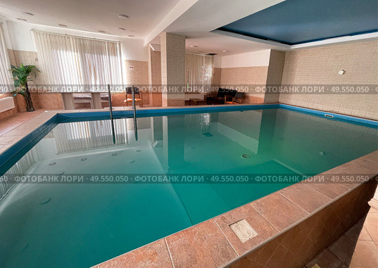 Swimming pool in the hotel in Zelenogradsk, Russia. Редакционное фото, фотограф Татьяна Кахилл / Фотобанк Лори