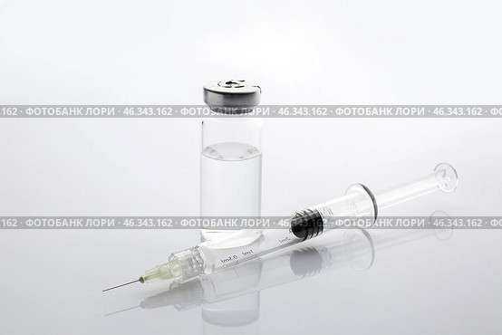 Syringe and ampule with filler for cosmetology on white background. Стоковое фото, фотограф Pixel_shot / Фотобанк Лори