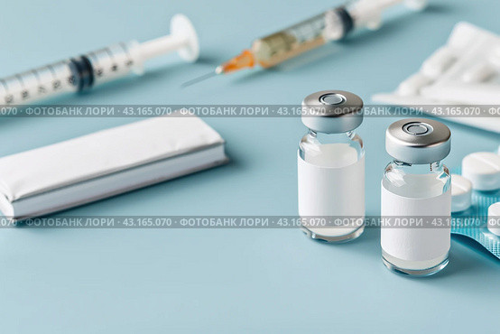 Syringe and glass vial on blue background table. Medical Vials group, needles, ampoules, bottle with medicines or vaccine. Disease treatment. Creative Banner. Anti-aging beauty injections. Vaccination. Стоковое AI-изображение, AI-художник Марина Демидюк / Фотобанк Лори