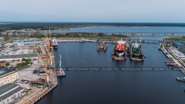 Tanker vessel repair in dry dock Shipyard, Drone shot. Стоковое фото, фотограф Aleksejs Bergmanis / Фотобанк Лори