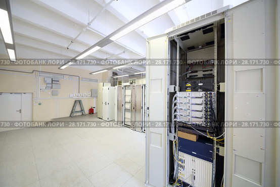 Telecom equipment with many cables and switches in big communication center. Стоковое фото, фотограф Losevsky Pavel / Фотобанк Лори