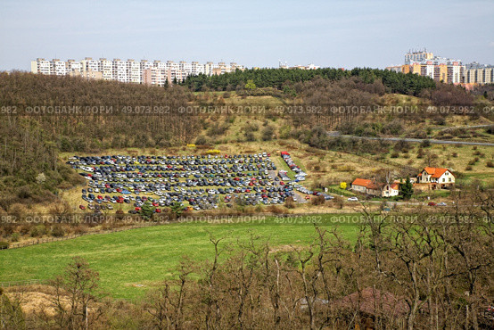 temporary car parking on the field. Стоковое фото, агентство Ingram Publishing / Фотобанк Лори