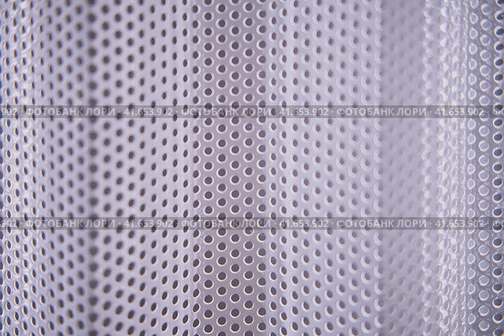 Texture of the iron bars with a metal surface and a uniform round holes. Стоковое фото, фотограф Андрей Журавлев / Фотобанк Лори