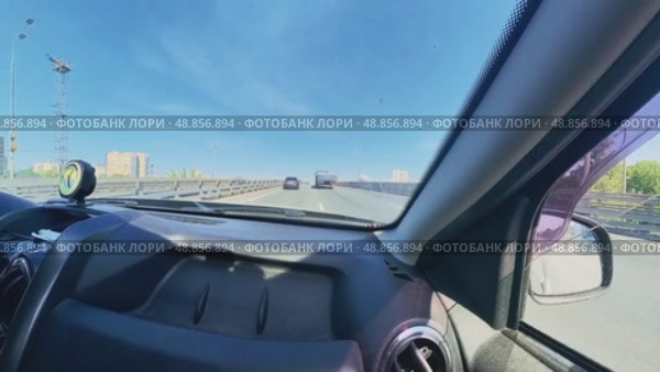 The car is traveling at high speed on the highway and catches up with the truck. Sunny weather. Стоковое видео, видеограф Ярославский Максим / Фотобанк Лори
