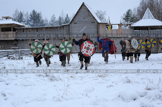 The festival is a historical reconstruction of the Viking Age in winter. Vikings attack with shields and helmets (2014 год). Редакционное фото, фотограф Анна Кривицкая / Фотобанк Лори