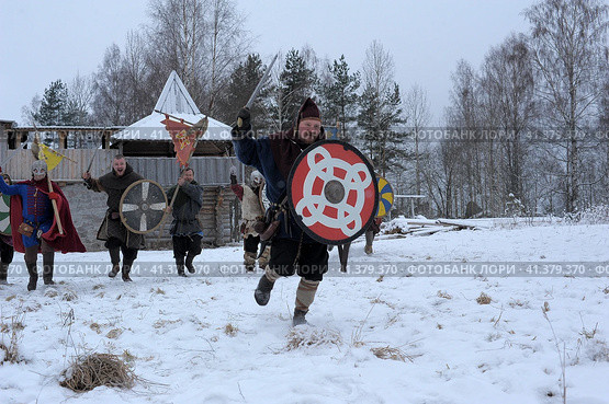 The festival is a historical reconstruction of the Viking Age in winter. Vikings attack with shields and helmets (2014 год). Редакционное фото, фотограф Анна Кривицкая / Фотобанк Лори
