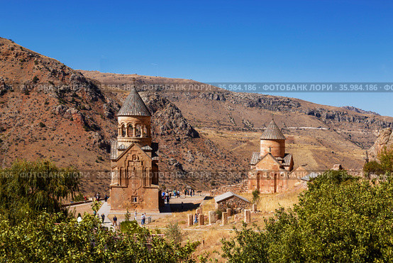 The medieval monastery of Noravank against the backdrop of mountains and blue sky in Armenia. Was founded in 1205. Top view. Стоковое фото, фотограф Наталья Волкова / Фотобанк Лори