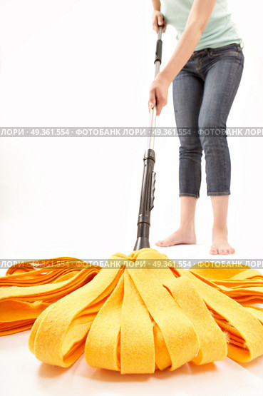 The person cleans a floor a mop on a white background. Cleaning. Стоковое фото, агентство Ingram Publishing / Фотобанк Лори
