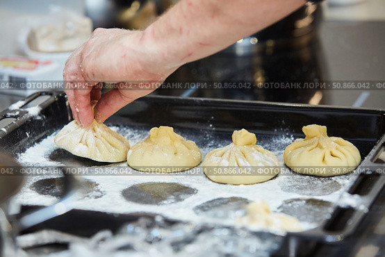 The process of cooking the national dish manta. Meat in the dough for subsequent cooking. Стоковое фото, фотограф Наталия Кирсанова / Фотобанк Лори