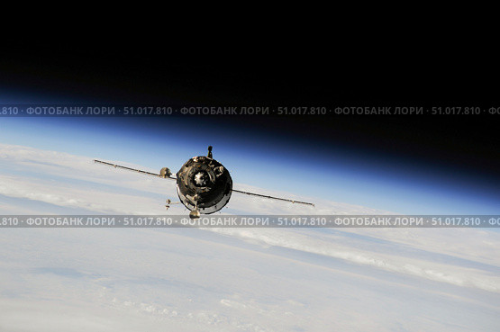 The Soyuz TMA-10M spacecraft in orbit above Earth. Стоковое фото, фотограф Stocktrek Images, Inc. / ТАСС / Фотобанк Лори