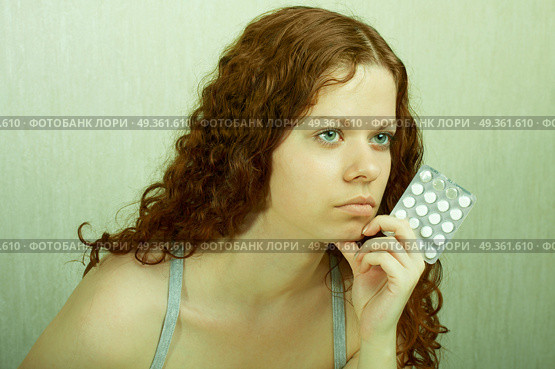 The thoughtful girl holds in a hand of a tablet and reflects on the developed situation. Condition of a hopelessness. Стоковое фото, агентство Ingram Publishing / Фотобанк Лори