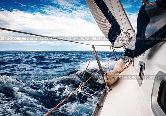 The white sails of yachts on the background of sea and sky in the clouds. Стоковое фото, агентство Ingram Publishing / Фотобанк Лори