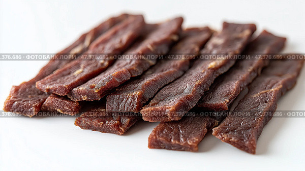 Thin slices of jerky, showing a rich, dark texture with visible marbling. Тонкие ломтики вяленого мяса с насыщенной, темной текстурой и видимой мраморностью. Стоковое AI-изображение, AI-художник Katsiaryna Repich / Фотобанк Лори