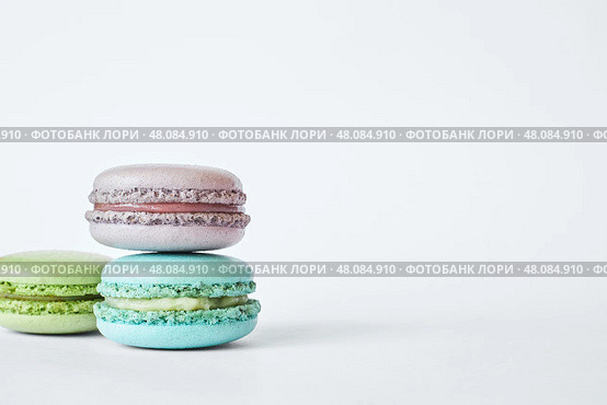 Three colorful French Macarons, stacked in pyramid. macaroons cakes. Стоковое фото, фотограф Екатерина Якименко / Фотобанк Лори