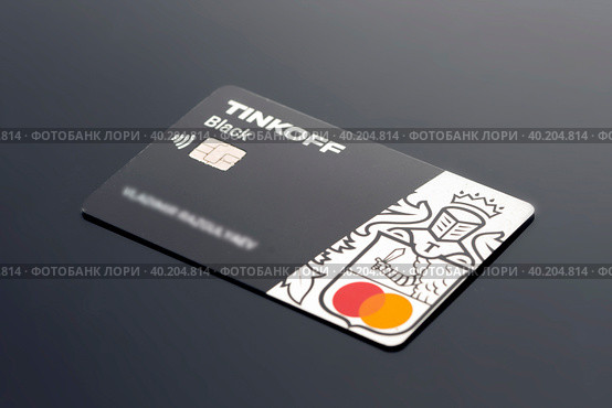 Tinkoff Bank plastic credit debit card close-up on black background. krasnoyarsk, russia, 2022 09 26. Редакционное фото, фотограф Владимир Разгуляев / Фотобанк Лори
