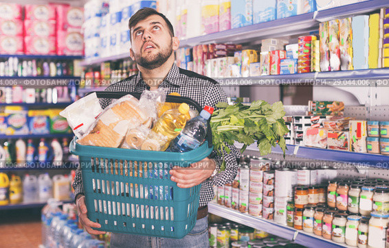 Tired man with heavy shopping basket. Стоковое фото, фотограф Яков Филимонов / Фотобанк Лори
