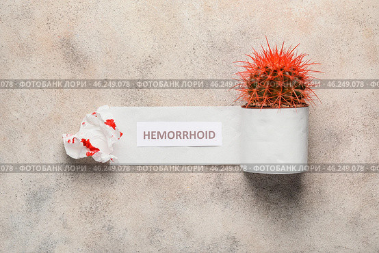 Toilet paper with cactus on light background. Hemorrhoids concept. Стоковое фото, фотограф Pixel_shot / Фотобанк Лори