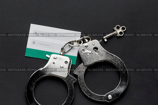 top view username password information with handcuffs. Стоковое фото, агентство Ingram Publishing / Фотобанк Лори