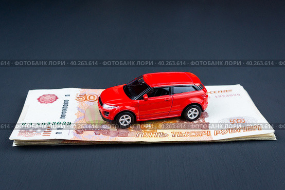 Toy car on money. Стоковое фото, фотограф Корнеев Вячеслав / Фотобанк Лори