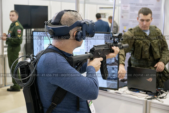 Training in shooting and defense against terrorist attacks in the virtual reality system at exhibition Interpolitex - Moscow, Russia, 10 25 2019. Редакционное фото, фотограф Андрей Журавлев / Фотобанк Лори