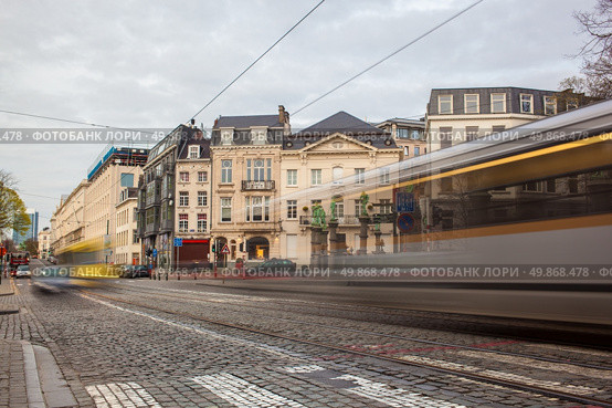 Tramway in motion on the street of Brussels near The Sablon Square. Стоковое фото, агентство Ingram Publishing / Фотобанк Лори