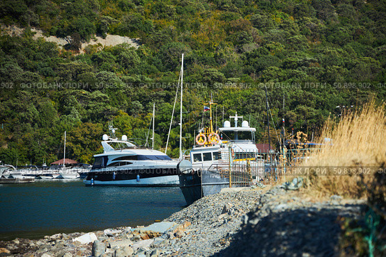 Utrish, Russia - September 07, 2022: Port and parking for yachts and ships. Редакционное фото, фотограф Наталия Кирсанова / Фотобанк Лори