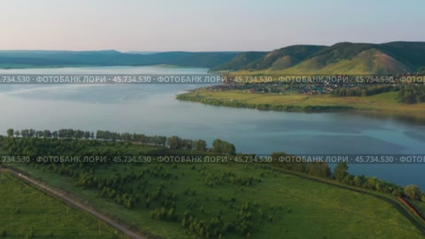 Южный Урал, Башкортостан, Нугушское водохранилище летом. Вид с воздуха. Southern Urals, Bashkortostan, Nugush reservoir in summer. Aerial view. Стоковое видео, видеограф Евгений Романов / Фотобанк Лори