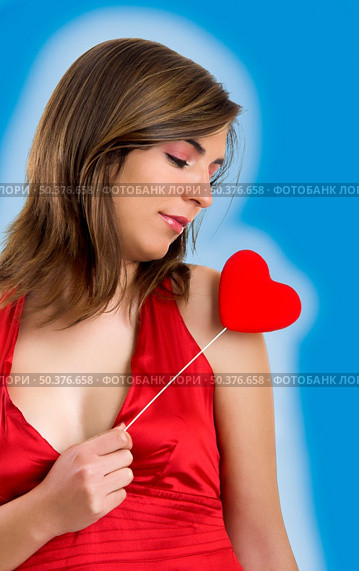 Valentine related pictures with a beautiful woman with a heart on the hands (blue background created on PS) Стоковое фото, агентство Ingram Publishing / Фотобанк Лори