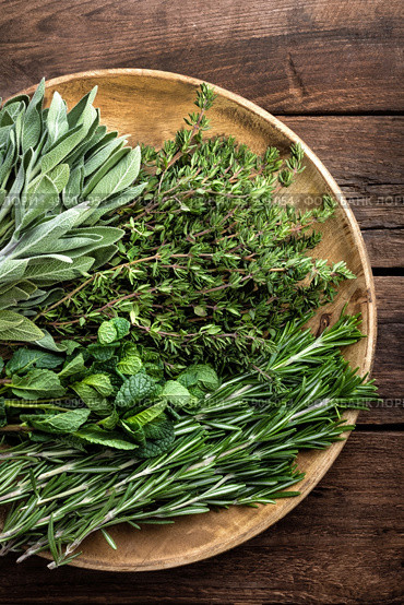 various fresh herbs, rosemary, thyme, mint and sage on wooden background. Стоковое фото, агентство Ingram Publishing / Фотобанк Лори