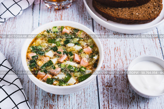 Vegetables sausage kvass soup with herbs in a bowl on the table. Стоковое фото, фотограф Елена Руй / Фотобанк Лори