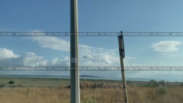 Вид из движущегося легкового автомобиля. Ахтанизовский лиман. Трасса А-290, Тамань, Темрюкский район, Краснодарский край, Россия. Стоковое видео, видеограф Щеголева Ольга / Фотобанк Лори