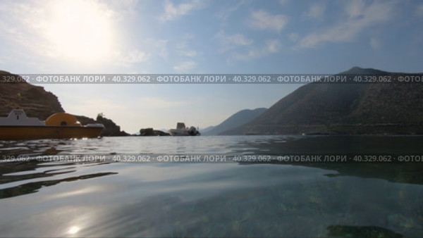 Video of motorboat in the bay on the beach of Karavostasi. Bali mediterranean resort, Crete, Greece. Редакционное видео, видеограф Сергей Пристяжнюк (Serg Zastavkin) / Фотобанк Лори