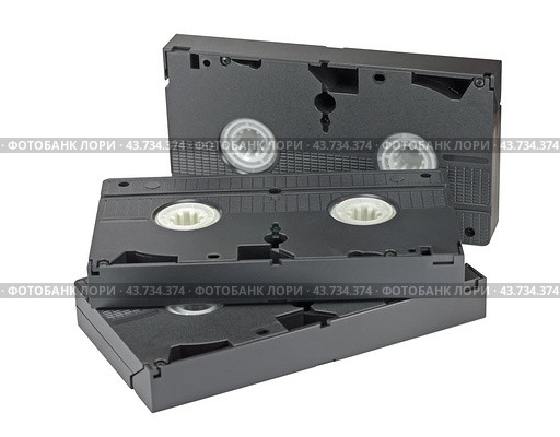 Видеокассеты формата VHS на белом фоне. VHS videotapes is isolated on a white background. Стоковое фото, фотограф Татьяна Д / Фотобанк Лори