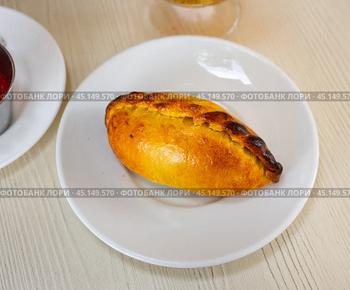 View of tasty empanada with cheese and jamon. Latin American traditional dish. Стоковое фото, фотограф Яков Филимонов / Фотобанк Лори