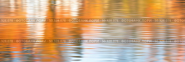 Warm hues of red, orange, and yellow dance across the still waters, mirroring the fiery colors of fall foliage. Стоковое AI-изображение, AI-художник Данила Большаков / Фотобанк Лори