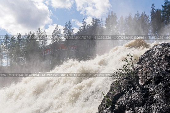 Waterfall during opened locks for idle discharge of water at a small hydroelectric power station. Стоковое фото, фотограф Евгений Харитонов / Фотобанк Лори