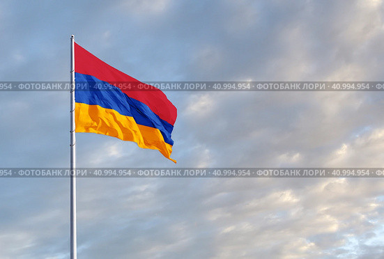 Waving Armenian flag against a blue sky with clouds and empty space for text. Room for text. Стоковое фото, фотограф Алексей Игнатов / Фотобанк Лори