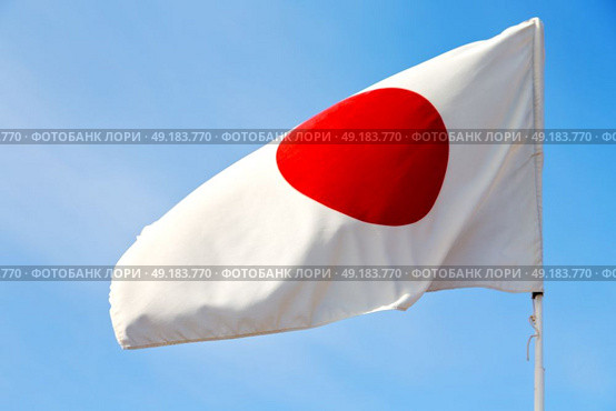 waving flag in the blue sky japancolour and wave. Стоковое фото, агентство Ingram Publishing / Фотобанк Лори