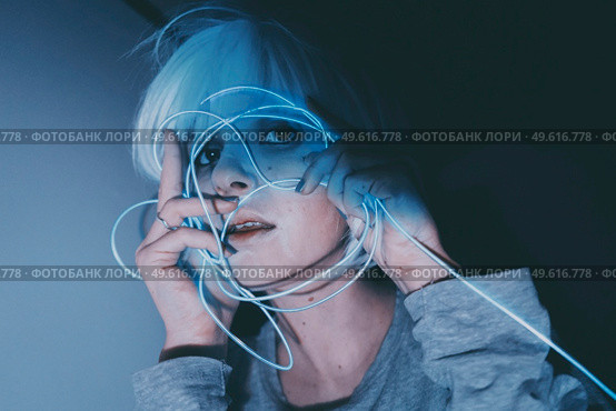 Weird dystopian theme portrait with blue neon lights. Стоковое фото, агентство Ingram Publishing / Фотобанк Лори