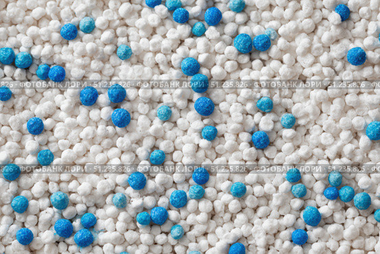 White cat litter round particles surface with small blue colored particles, top view. Granules of pet white-gray litter background. Dog litter texture backdrop with small dots. Flat lay, copy space. Стоковое AI-изображение, AI-художник Марина Демидюк / Фотобанк Лори