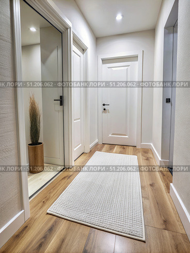 White Doorway With A White Rug Leading Into An Apartment. Generative AI. Стоковое AI-изображение, AI-художник Roman Zavorotny / Фотобанк Лори